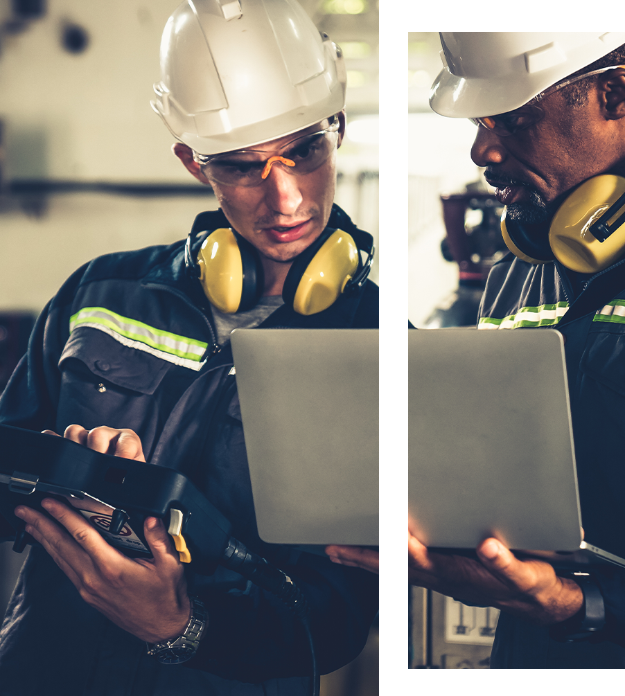 Engineer in white helmet with laptop